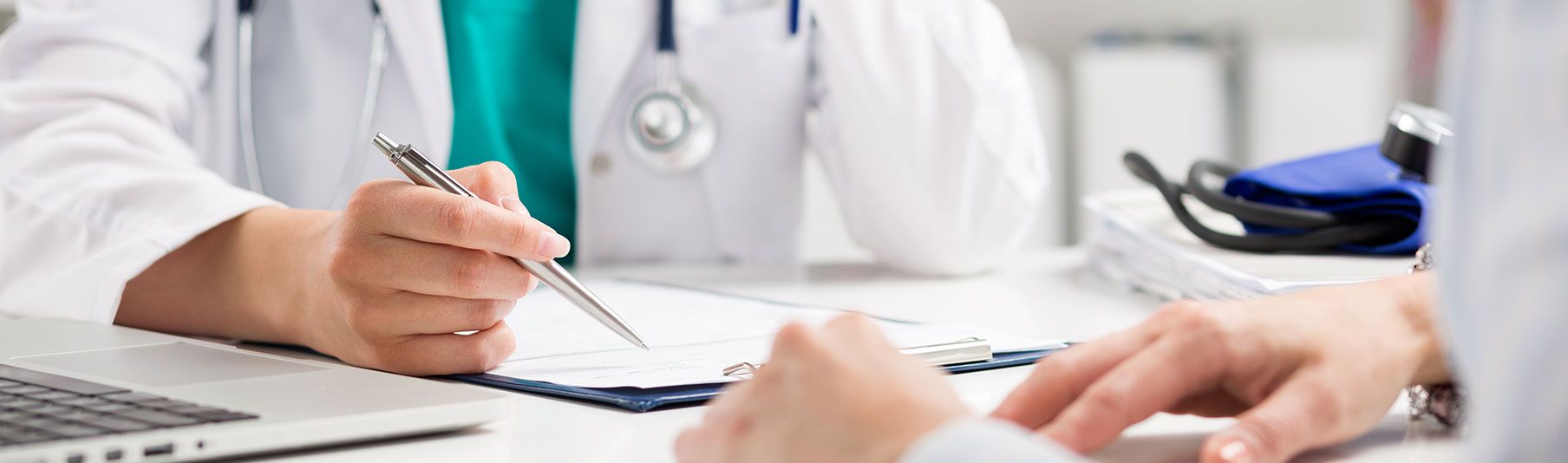 Additional Locum Insurance Covers: A doctor checking over a medical form