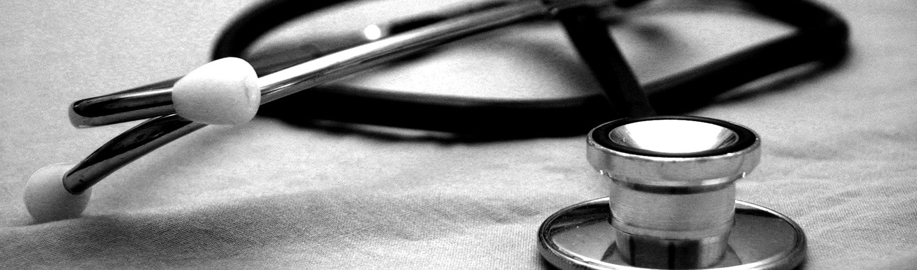 FAQs: Close-up black and white picture of a stephoscope